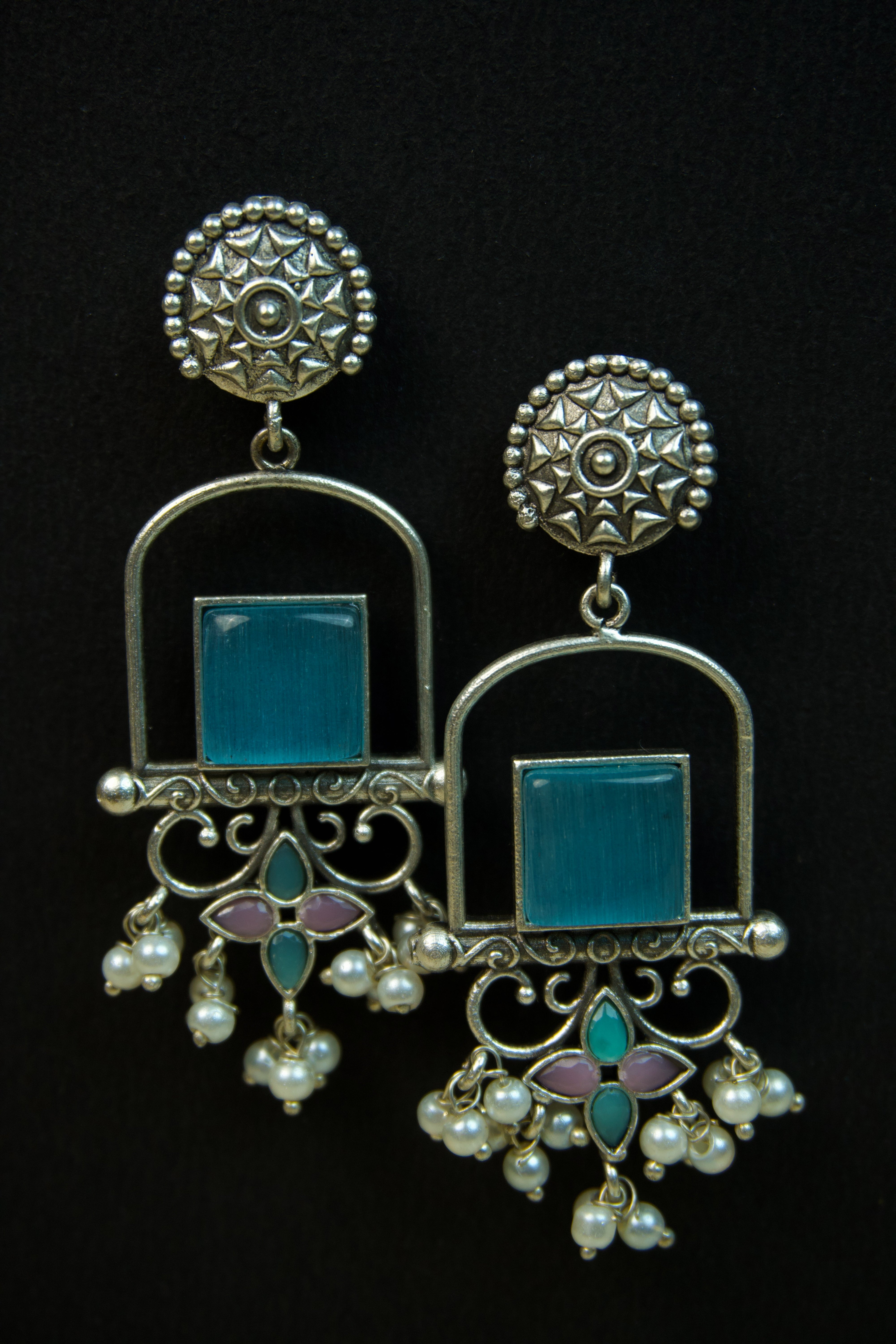 Pair of silver Oxidized earrings with pearl beads  in Brass metal Main image